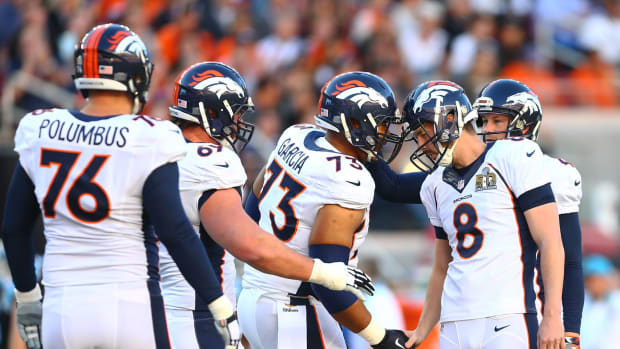 Denver Broncos kicker Brandon McManus (8) celebrates with center Max Garcia (73) and teammates after a field goal against the Carolina Panthers in Super Bowl 50 at Levi's Stadium.